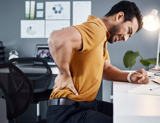 When did back pain become part of having a desk job?